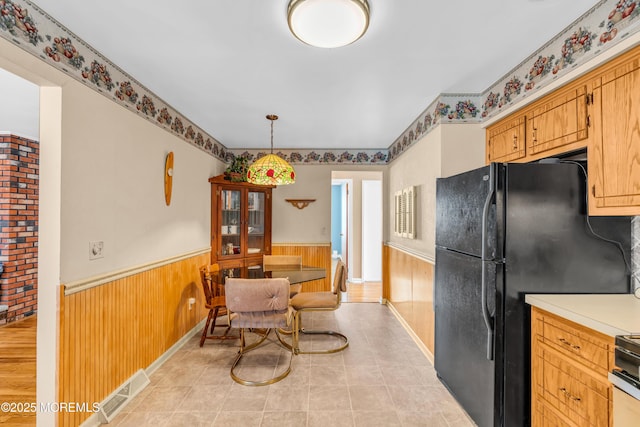 21 Clearwater Way, Toms River, NJ 08753 - kitchen with a wainscoted wall, light countertops, light tile patterned floors, wood walls, and pendant lighting