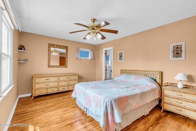 21 Clearwater Way, Toms River, NJ 08753 - bedroom with light wood-type flooring, multiple windows, and ceiling fan