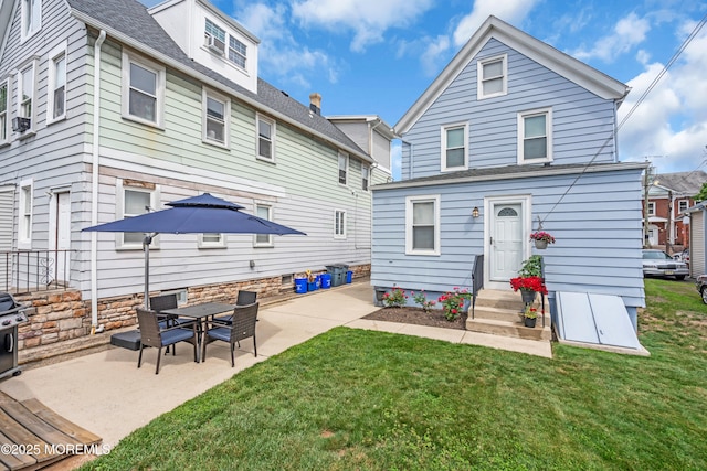 143 Emerson St, Carteret, NJ 07008 - back of property featuring a patio and a lawn