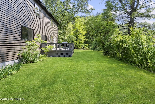 4 Penny Ct, East Brunswick, NJ 08816 - view of grassy yard with a wooden deck