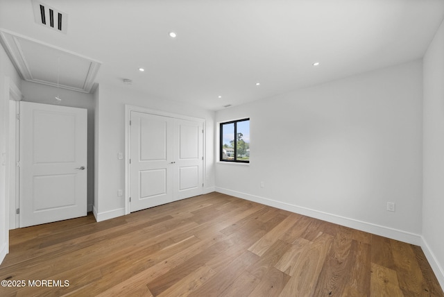 4 Penny Ct, East Brunswick, NJ 08816 - unfurnished bedroom featuring attic access, light wood finished floors, baseboards, a closet, and recessed lighting