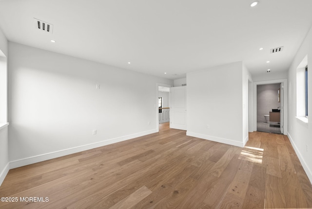 4 Penny Ct, East Brunswick, NJ 08816 - unfurnished living room with light wood-style floors, recessed lighting, and baseboards
