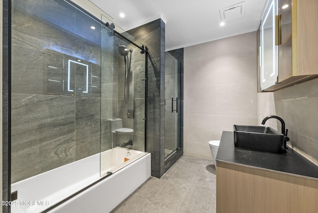 4 Penny Ct, East Brunswick, NJ 08816 - full bathroom featuring toilet, tile walls, vanity, shower / bath combination with glass door, and recessed lighting
