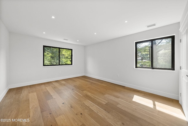 4 Penny Ct, East Brunswick, NJ 08816 - spare room featuring healthy amount of natural light, light wood finished floors, baseboards, and recessed lighting