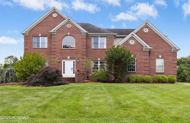 7 Topaz Dr, Jackson, NJ 08527 - colonial home featuring brick siding and a front yard