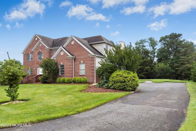 7 Topaz Dr, Jackson, NJ 08527 - view of front of house with brick siding, a front yard, and driveway