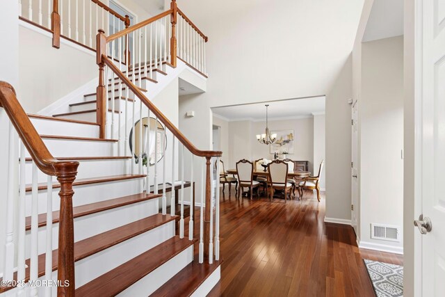 7 Topaz Dr, Jackson, NJ 08527 - staircase featuring hardwood / wood-style floors, ornamental molding, and a chandelier