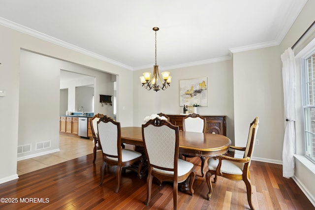 7 Topaz Dr, Jackson, NJ 08527 - dining room with a chandelier, ornamental molding, and light wood-style flooring