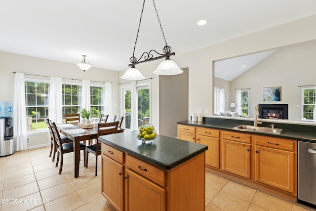 7 Topaz Dr, Jackson, NJ 08527 - kitchen with stainless steel dishwasher, dark countertops, light tile patterned floors, lofted ceiling, and hanging light fixtures
