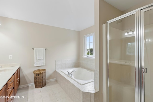 7 Topaz Dr, Jackson, NJ 08527 - bathroom featuring double vanity, a garden tub, tile patterned floors, a stall shower, and lofted ceiling