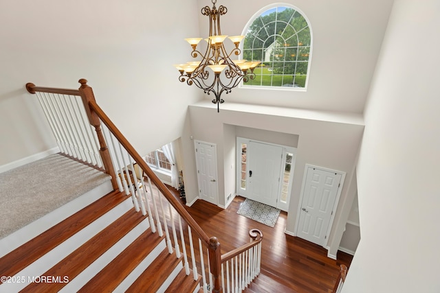 7 Topaz Dr, Jackson, NJ 08527 - foyer entrance with a chandelier, wood finished floors, a high ceiling, and stairs