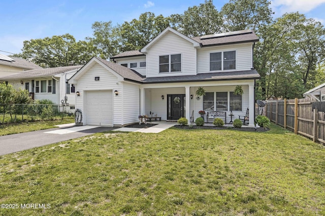 62 E 5th St, Howell, NJ 07731 - traditional-style house featuring covered porch, a garage, solar panels, asphalt driveway, and a shingled roof