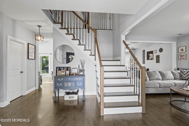 62 E 5th St, Howell, NJ 07731 - staircase featuring wood finished floors and baseboards
