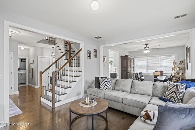 62 E 5th St, Howell, NJ 07731 - living area with stairway, dark wood-style flooring, ceiling fan, baseboards, and washer / clothes dryer