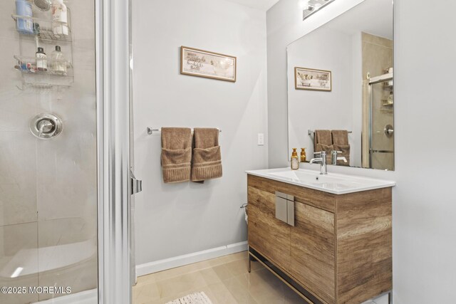 62 E 5th St, Howell, NJ 07731 - bathroom featuring a stall shower, vanity, baseboards, and tile patterned floors