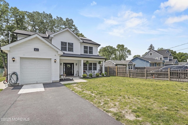 62 E 5th St, Howell, NJ 07731 - traditional home featuring a porch, driveway, and an attached garage