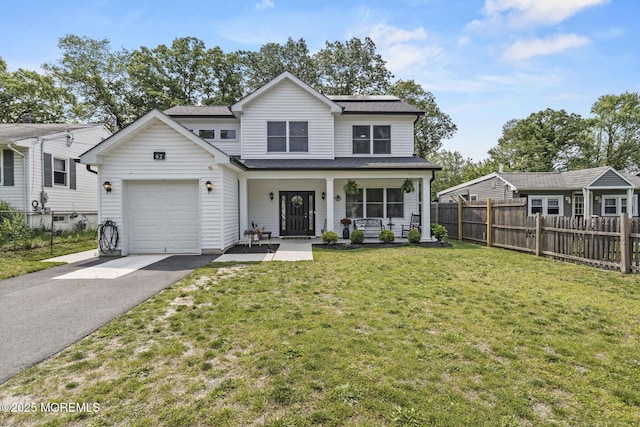 62 E 5th St, Howell, NJ 07731 - traditional-style house featuring a porch, driveway, and a garage