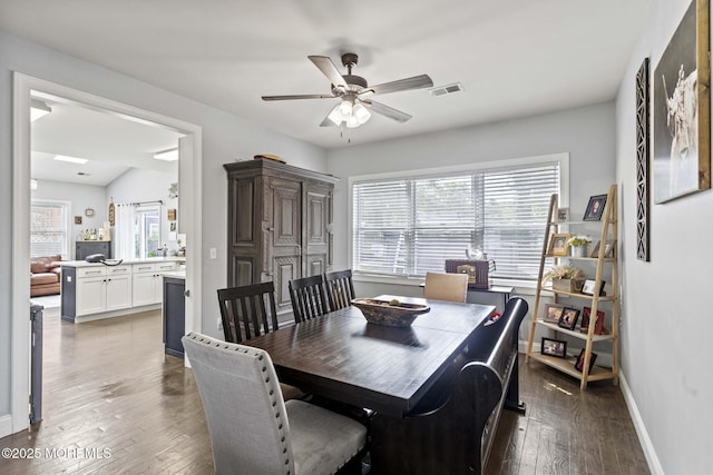 62 E 5th St, Howell, NJ 07731 - dining area with plenty of natural light, wood-type flooring, a ceiling fan, and baseboards