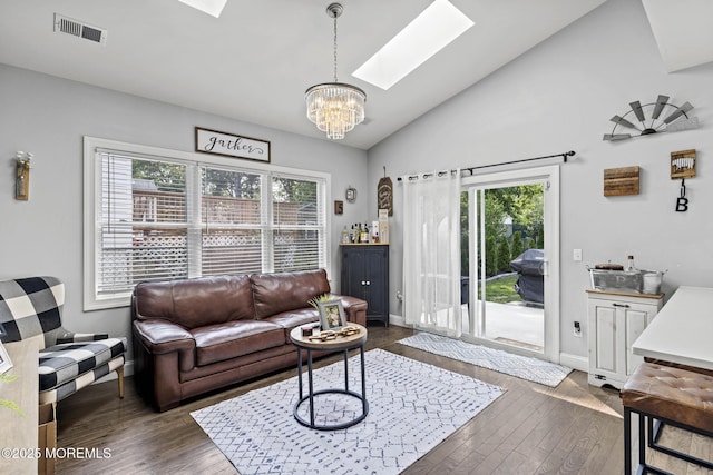 62 E 5th St, Howell, NJ 07731 - living area with a skylight, dark wood-style flooring, plenty of natural light, a chandelier, and lofted ceiling
