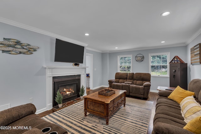 7 Elizabeth Pkwy, Eatontown, NJ 07724 - living area featuring wood finished floors, a glass covered fireplace, recessed lighting, ornamental molding, and baseboards
