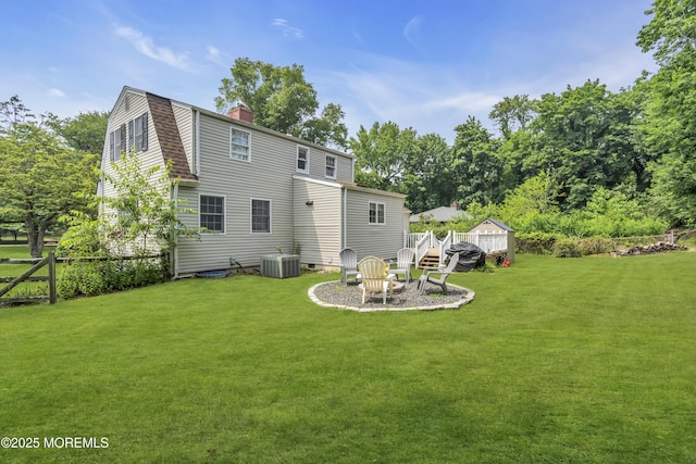 7 Elizabeth Pkwy, Eatontown, NJ 07724 - back of house with cooling unit, a chimney, a wooden deck, and a gambrel roof