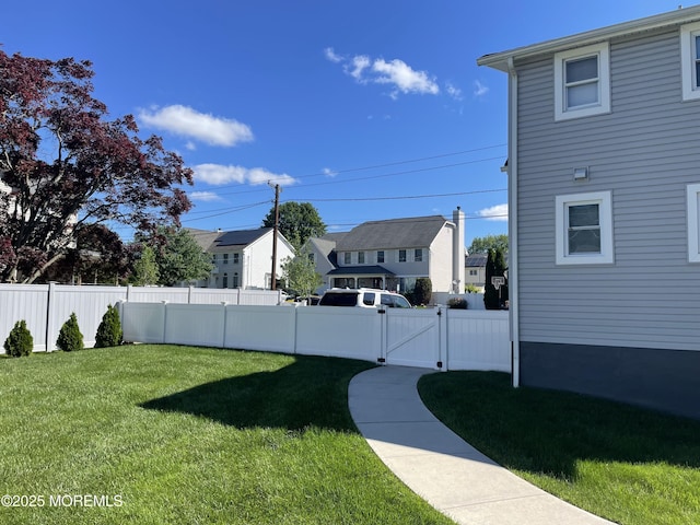 147 Joseph St, East Brunswick, NJ 08816 - fenced backyard with a gate and a residential view