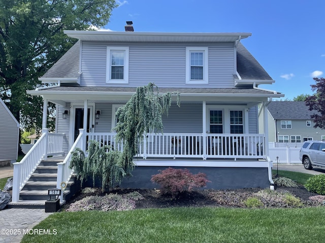 147 Joseph St, East Brunswick, NJ 08816 - view of front of home with a porch and a chimney