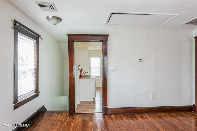 147 Joseph St, East Brunswick, NJ 08816 - empty room with attic access and wood finished floors
