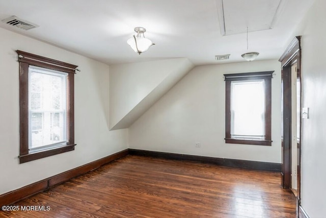147 Joseph St, East Brunswick, NJ 08816 - additional living space with attic access, dark wood-type flooring, and healthy amount of natural light