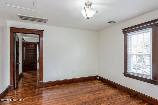 147 Joseph St, East Brunswick, NJ 08816 - empty room with dark wood-type flooring and baseboards