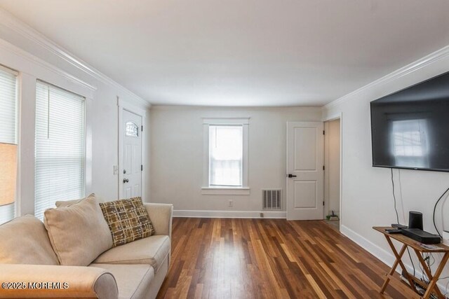 147 Joseph St, East Brunswick, NJ 08816 - living area featuring wood finished floors and crown molding