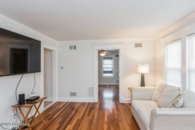 147 Joseph St, East Brunswick, NJ 08816 - living room with wood finished floors, crown molding, and a ceiling fan
