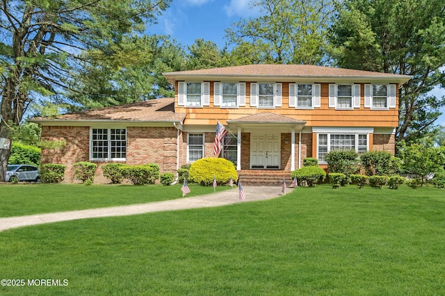 330 Green Grove Rd, Ocean Twp, NJ 07712 - view of front of house with a front yard, brick siding, and roof with shingles