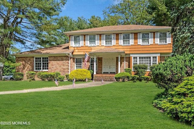 330 Green Grove Rd, Ocean Twp, NJ 07712 - view of front of property with a front yard, brick siding, and a shingled roof