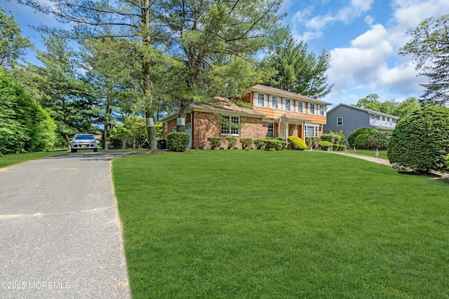 330 Green Grove Rd, Ocean Twp, NJ 07712 - view of front of house with a front yard, asphalt driveway, and brick siding