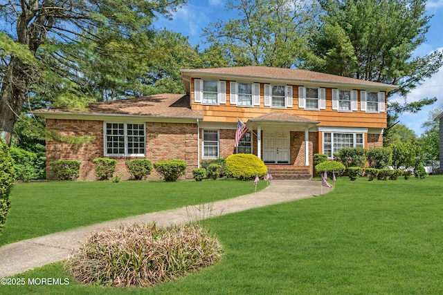 330 Green Grove Rd, Ocean Twp, NJ 07712 - view of front of house featuring brick siding, a front lawn, and roof with shingles