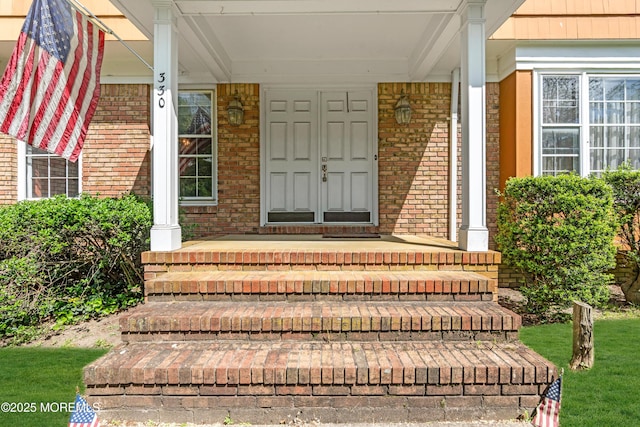 330 Green Grove Rd, Ocean Twp, NJ 07712 - property entrance featuring covered porch and brick siding