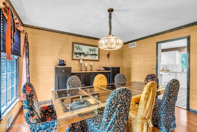 330 Green Grove Rd, Ocean Twp, NJ 07712 - dining space featuring light wood finished floors and crown molding