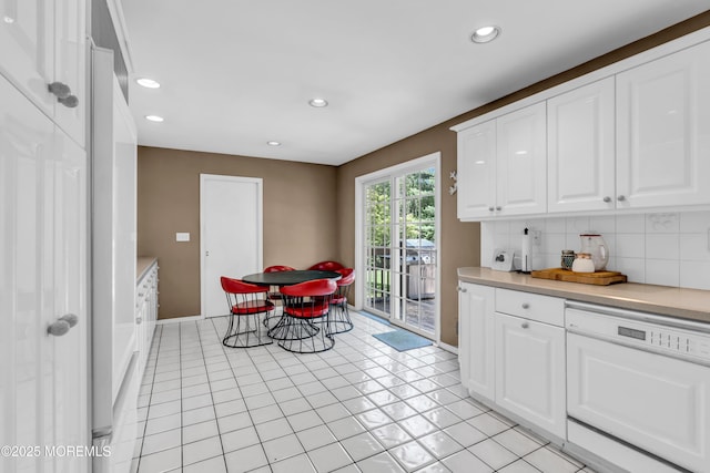 330 Green Grove Rd, Ocean Twp, NJ 07712 - kitchen with recessed lighting, white cabinetry, light countertops, tasteful backsplash, and baseboards