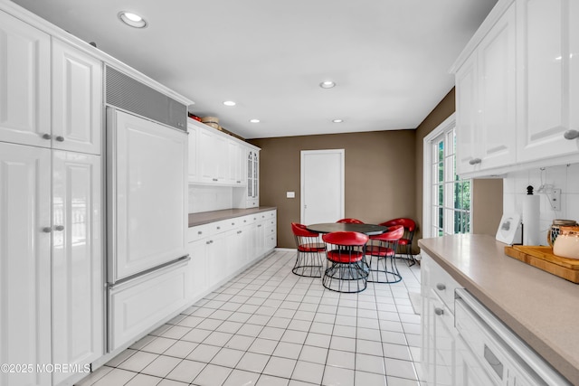 330 Green Grove Rd, Ocean Twp, NJ 07712 - kitchen with white cabinetry, recessed lighting, paneled built in fridge, light countertops, and light tile patterned flooring
