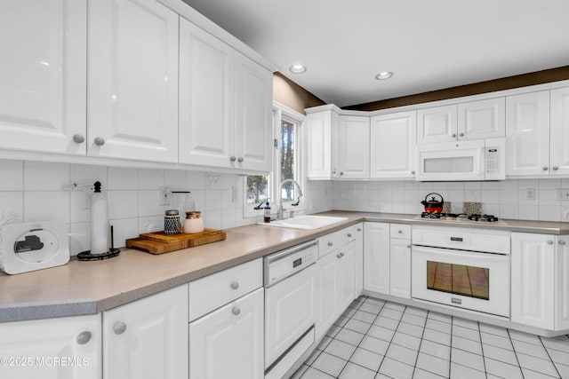 330 Green Grove Rd, Ocean Twp, NJ 07712 - kitchen featuring white appliances, a sink, white cabinetry, decorative backsplash, and recessed lighting