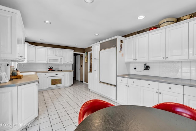 330 Green Grove Rd, Ocean Twp, NJ 07712 - kitchen featuring white appliances, decorative backsplash, white cabinets, and recessed lighting