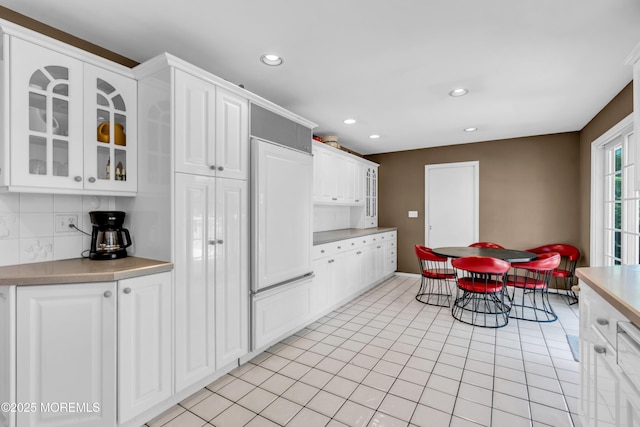 330 Green Grove Rd, Ocean Twp, NJ 07712 - kitchen with white cabinets, glass insert cabinets, decorative backsplash, paneled built in refrigerator, and recessed lighting