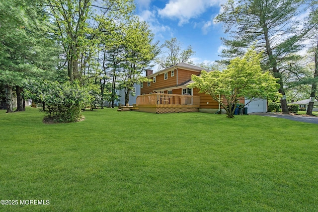 330 Green Grove Rd, Ocean Twp, NJ 07712 - view of green lawn featuring asphalt driveway, a deck, and a garage
