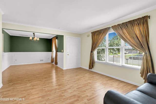 11 Adler Cir, Lumberton, NJ 08048 - living area with crown molding, light wood-type flooring, a chandelier, and wainscoting