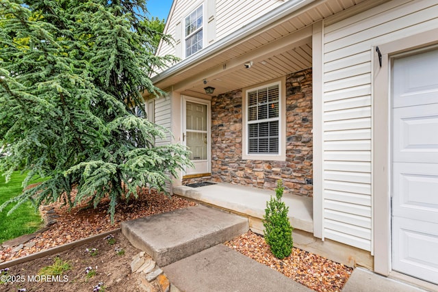 11 Adler Cir, Lumberton, NJ 08048 - view of exterior entry with a porch and stone siding
