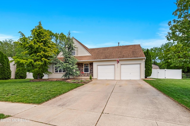 11 Adler Cir, Lumberton, NJ 08048 - view of front facade with an attached garage, concrete driveway, a gate, roof with shingles, and stone siding