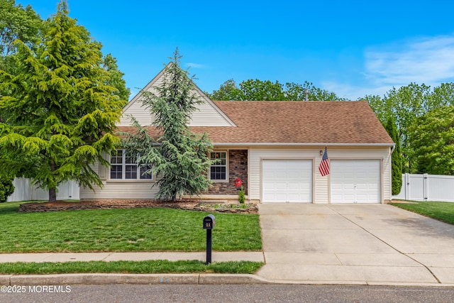 11 Adler Cir, Lumberton, NJ 08048 - view of front facade featuring an attached garage, concrete driveway, roof with shingles, a gate, and stone siding