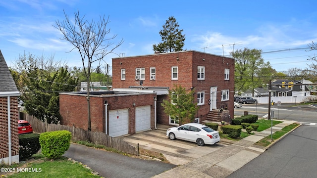 1020 Raritan Ave, Highland Park, NJ 08904 - view of building exterior featuring a garage and asphalt driveway