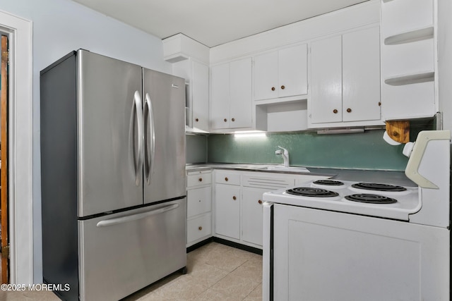 1020 Raritan Ave, Highland Park, NJ 08904 - kitchen featuring freestanding refrigerator, white electric range, open shelves, and white cabinetry